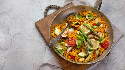 Vegan Paella on gray background.