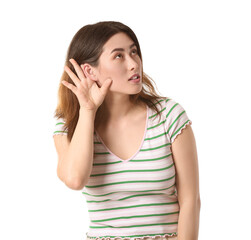 Fototapeta premium Young Asian woman trying to hear something on white background