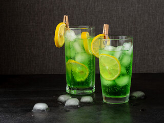 refreshing cocktail with ice on a dark background