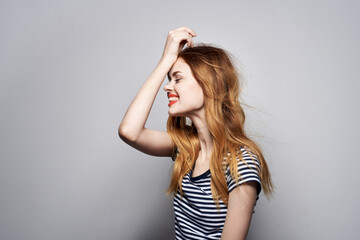 Fototapeta premium pretty woman holding hair makeup posing fun fashion model studio