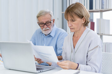 Stressed husband, wife senior couple elderly family, caucasian mature, retired calculate budget from invoice, expense or bill, no money to pay. Mortgage, loan causing debt, bankruptcy of financial.