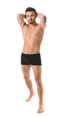 Fototapeta premium Handsome young man in underwear on white background