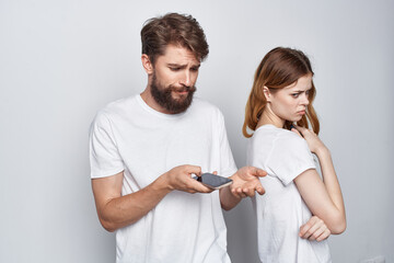 man and woman quarrel jealousy telephones communication isolated background