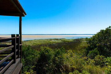 Fototapeta premium Viewpoint iSimangaliso Wetland Park, a protected area on the east coast of the South African province of KwaZulu-Natal. St. Lucia South Africa. Tourism and vacations concept