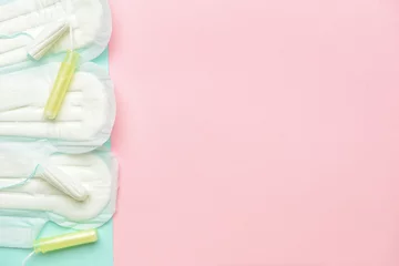 Foto op Canvas Menstrual pads and tampons on color background © Pixel-Shot