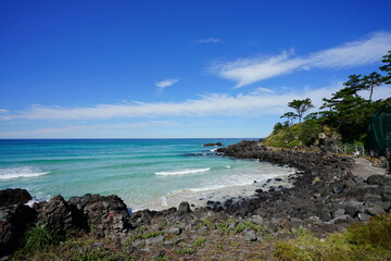 a seaside walkway and clear blue sea