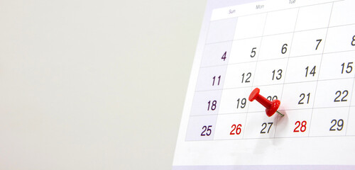 Red pin on calendar page with copy space. concept of  Monthly business planning, appointment,...