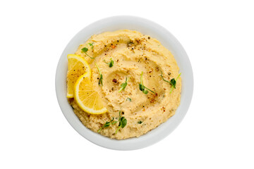 Plate with delicious hummus and lemon on white background