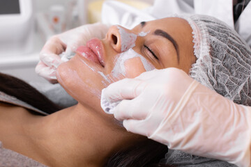 Procedure for manual cleansing of the facial skin from blackheads and acne. Beauty parlour.