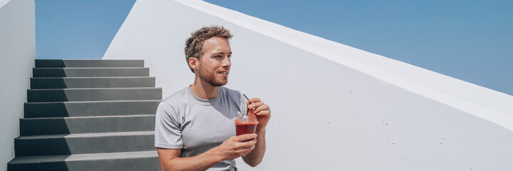 Man drinking red beet smoothie detox juice healthy lifestyle panoramic banner. Athlete young runner...
