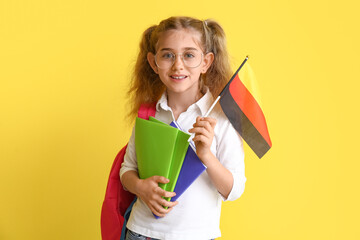 Pupil of language school with German flag on color background
