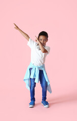 Dancing African-American boy on color background