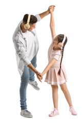 Fototapeta premium Dancing man and his little daughter on white background