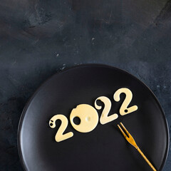 Christmas and New year concept of 2022. Minimal logo for period of time with light cheese snack on...