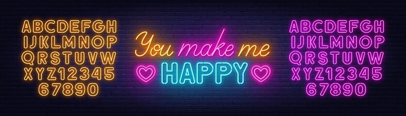 You Make Me Happy neon sign on brick wall background.