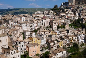 Fototapeta na wymiar Panoramic view of old townhouses in Baroque city Ragusa, UNESCO World Heritage Site. Sicily, Italy.