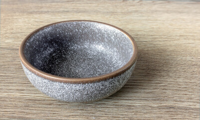 Ceramic dish on an ash table