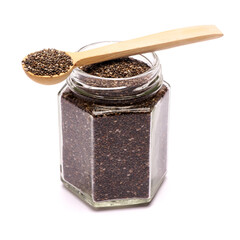 glass can full of organic natural chia seeds close-up isolated on white background