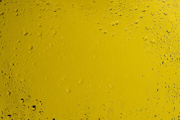 Yellow backgrond with water drops.