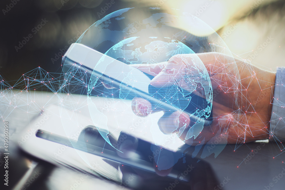 Poster Close up of hands using tablet and smartphone with creative glowing globe with polygonal connections on blurry bright outdoor background. Big data, futuristic world and business concept. 