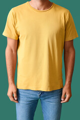 Handsome young man in stylish t-shirt on color background