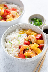 White rice with shrimps and pineapple curry. Asian cuisine food, closeup view