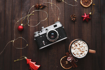 composition with an old camera and New Year's decor, flatlay