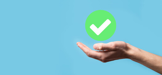 Hand holds green icon Check mark,Check Mark Sign, Tick Icon,right sign,circle green checkmark...