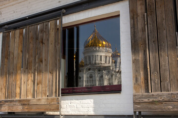 Cathedral of Christ the Savior reflecting in the window. Abstract image, orthodox church. Moscow, Russia.