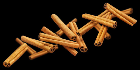 Flying cinnamon sticks, isolated on black background