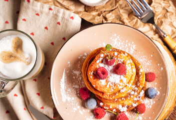 Cottage cheese pancakes, Syrniki with fresh mint. Pancakes with cottage cheese on a brown plate, Homemade food