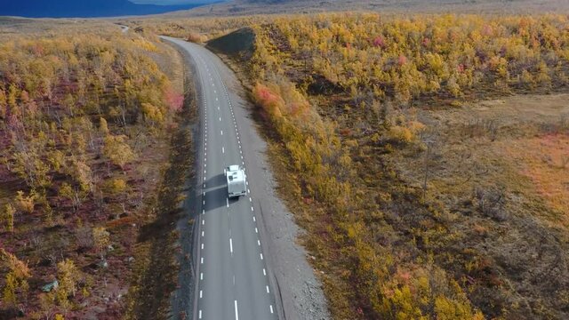50fps drone footgage Car Camping Caravan driving road lake Swedish Lapland Sunny fall colors Abisko National Park Sweden