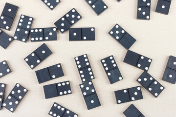 Board game dominoes on light table. View from above.