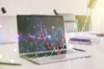 Abstract creative financial graph on modern laptop background, financial and trading concept. Multiexposure
