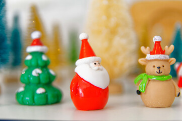 Decoration figurines with santa and christmas trees