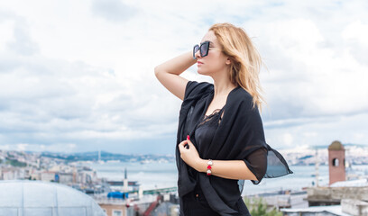 Travelling concept. Modern beautiful woman in city Istanbul, vacation in Turkey.
