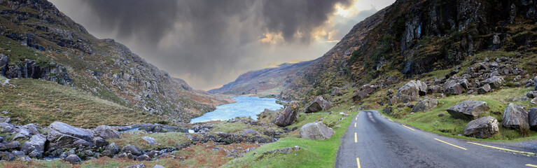 A storm approaches the winding roads at Gap of Dunloe in Ring of Kerry, a narrow mountain pass...