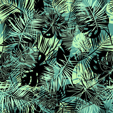 Seamless pattern of palm leaves and monstera. Tropical pattern in emerald and black. Botanical elegant vector for print and for your design.