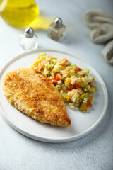 Homemade chicken schnitzel with rice and vegetables