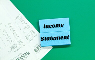 receipts and colored boards with the words income statement