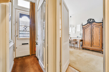 A long superb corridor with an open door leading to another room