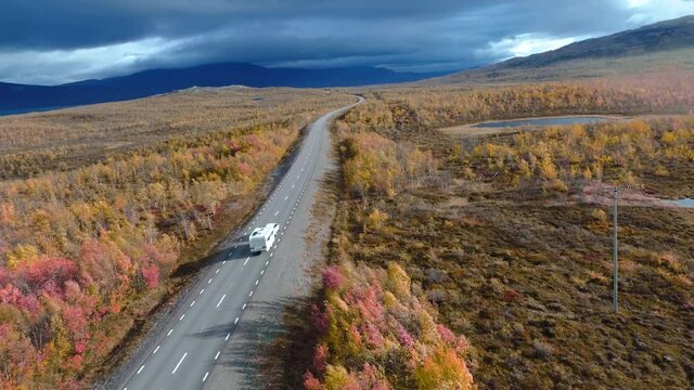 50fps drone footgage Car Camping Caravan driving road lake Swedish Lapland Sunny fall colors Abisko National Park Sweden