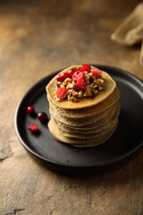 Homemade buckwheat pancakes with cranberry and walnut