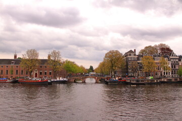 Fototapeta na wymiar Beautiful view of the canals in the city of Amsterdam. 