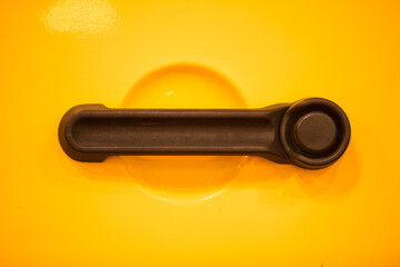 Modern door handle of a yellow car