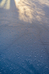 Ice texture frozen lake surface on sunny day