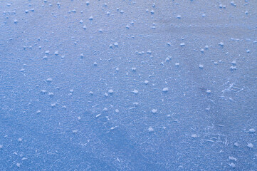 Ice texture frozen lake surface on sunny day