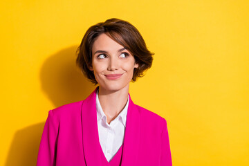 Photo of lovely millennial brunette lady look empty space wear pink blazer isolated on yellow color...