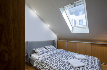 Fototapeta na wymiar Interior of a loft bedroom