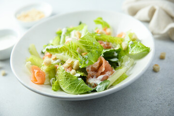 Traditional homemade Caesar salad with smoked salmon